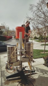 Jess transferring sweet wort from the mash tun to the boil kettle.