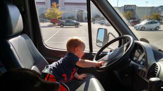 Alex having a blast in the driver's seat.